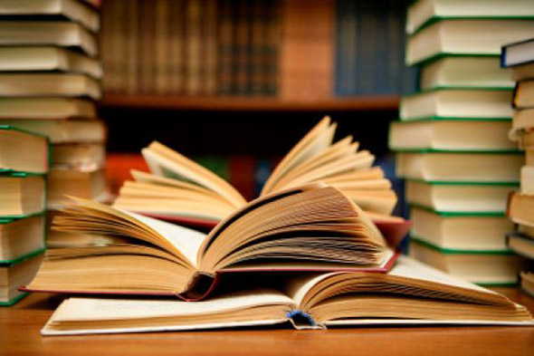 open and stacked books everywhere